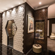 ​​​​​​​The keyhole-shaped entry to this shower was inspired brown, black