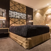 ​​​​​​​Dramatic cabinetry and luminous or gold finishes come orange, brown, black