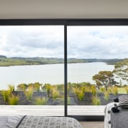 ​​​​​​​Tawny carpets in this home’s bedrooms connect with 