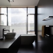 The dark and dramatic main bathroom. - Rustic 