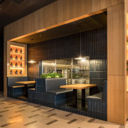 Intimate booths are part of the Oh Yeah architecture, building, cabinetry, ceiling, design, door, facade, floor, flooring, furniture, home, house, interior design, lighting, lobby, property, real estate, room, tile, wall, black, brown, orange