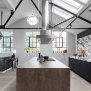 Designer: "We created bespoke stainless steel extractor suspended 