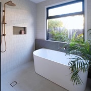 The soap niche tiles echo the wall tiles 