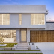Front facade with wood-fronted garage door contrasting the 