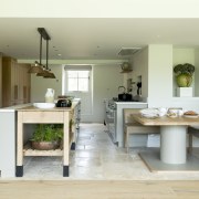 The aesthetic throughout uses natural oak with a 