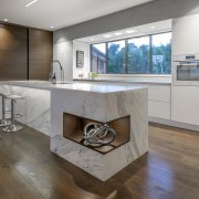 A timber-lined corner display niche in the island architecture, beige, building, cabinetry, ceiling, countertop, design, floor, flooring, furniture, hardwood, home, house, interior design, kitchen, living room, material property, property, real estate, room, table, tile, wood flooring, gray, brown