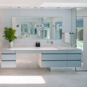 Light blue floating cabinets mirror each other across 