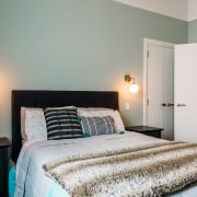 Master bedroom with feature sconces. - Now and 