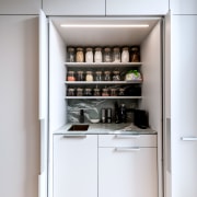 Pantry work area with tuck away doors. - 