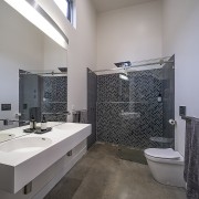 The high-ceilinged upper level master ensuite takes in 