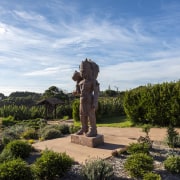 A statue beside the pétanque area. - Ancient 