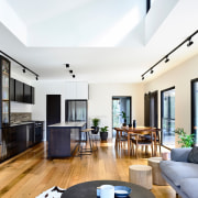 Locally sourced recycled Australian hardwood floorboards line the 