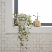 An Alarti Marble mosaic wall finish introduces a 