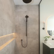 Gun Metal fixtures and an internally lit wall 