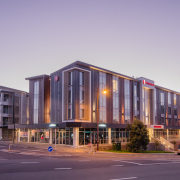 Holmes Consulting Tourism &amp; Leisure Property Award – apartment, architecture, building, city, commercial building, condominium, corporate headquarters, downtown, evening, facade, headquarters, home, metropolitan area, mixed use, real estate, residential area, sky, purple