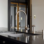 Pewter toned taps and pourer complement the island's 