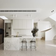 The kitchen's aesthetic, colour palette and textures have 