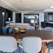 Dark wall treatments balance the dramatic black and 