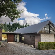 Timber cladding and an existing corrugated iron roof 