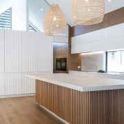 The kitchen pendants add to the airy feel 