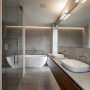 The main bathroom has an edgy, modern feel. 