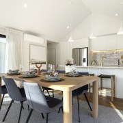 The dining area with kitchen at rear and 