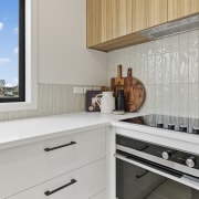 Concealed ventilation, a tactile tile splashback and the 