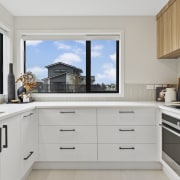 Crisp, modern and efficient, the kitchen boasts a 