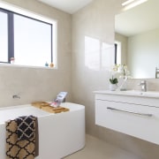 The upstairs main bathroom with curvaceous, against the 