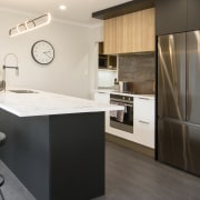 An on-trends slender benchtop serves the breakfast bar 