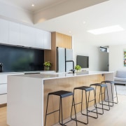 Birch plywood timber lines the full height cabinets 