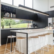 A window splashback floods natural light on the 