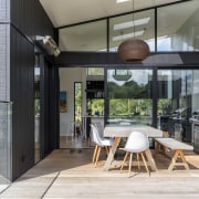 The U-shaped home embraces a covered central deck 