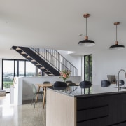 Looking to the dining area and stairs beyond 