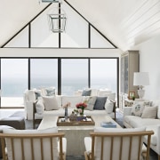 White upholstery with subtle accents play off the 