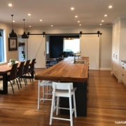 Kitchen and Dining Area - building | cabinetry building, cabinetry, ceiling, countertop, dining room, floor, flooring, furniture, hardwood, home, house, interior design, kitchen, laminate flooring, light fixture, lighting, property, real estate, room, table, wood, wood flooring, brown