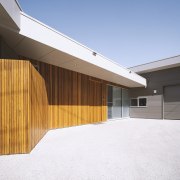 Warm timber cladding welcomes you to the entry 