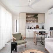 The kitchen cabinetry acts as room divider between 