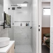 Modest, tucked-away bathroom at the end of the 