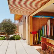 A customised surfboard storage unit and garage provide 