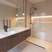 Shared ensuite with cantilevered vanity and generous shower 