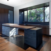 The kitchen island is composed of elements that 