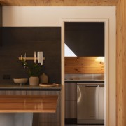 The structure of the house is constructed from black, orange, brown