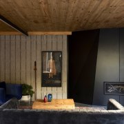 The interior features stark contrasts between warm and brown, black