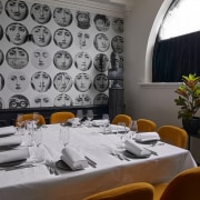 Fornasetti wallpaper is featured in many secret areas 