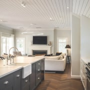 Kitchen with informal lounge beyond. - At home 