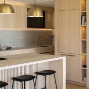 Kitchen detail showing light-toned materiality. 