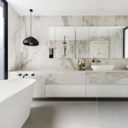 The vanity in this ensuite runs the length architecture, bathroom, floor, flooring, interior design, room, sink, tap, tile, wall, gray