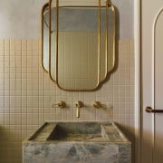 The custom vanity in Emerald Haze Quartzite designed 