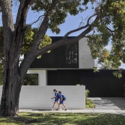 From the street, the comprehensively renovated home presents 